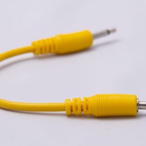 A yellow 3.5mm x 10cm patch cable.