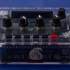 Front and top view of Shruthi, showing paisley emblem and logo.